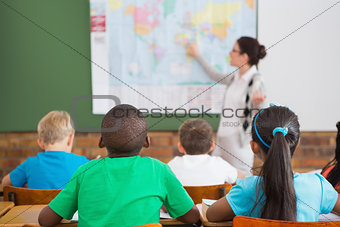 Teacher giving a geography lesson in classroom