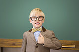Cute pupil dressed up as teacher in classroom