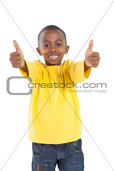 Happy little boy showing thumbs up