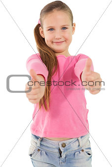 Cute little girl showing thumbs up
