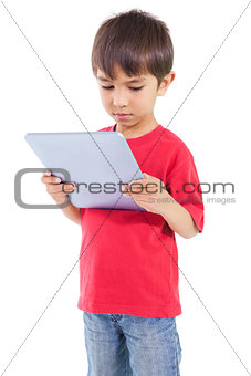 Cute little boy using tablet pc