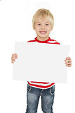 Cute little boy showing white page