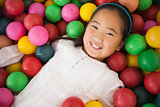 Happy girl playing in ball pool