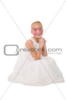 Happy little girl in butterfly face paint