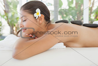 Beautiful brunette relaxing on massage table