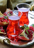 pomegranate fruit tea in traditional glass cups