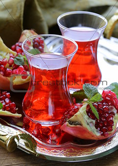 pomegranate fruit tea in traditional glass cups