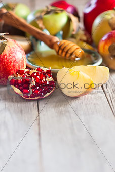Pomegranate, apples and honey background