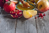 Pomegranate, apples and honey background