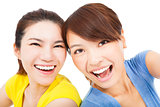 Closeup portrait of happy young girls over white background