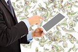 business man touching tablet with money rain