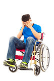upset handicapped man sitting on a wheelchair