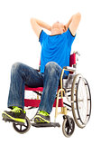 depressed and handicapped man sitting on a wheelchair
