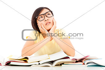 young student girl thinking with book on the desk
