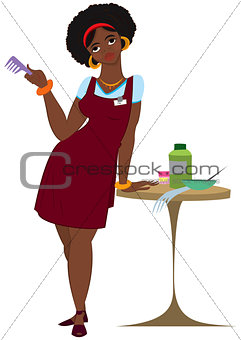 Cartoon black woman hairdresser standing in red apron