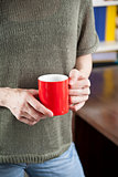 hand red coffee cup