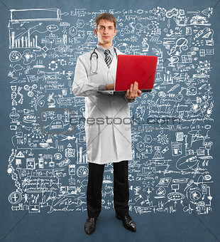 doctor male in suit with laptop in his hands