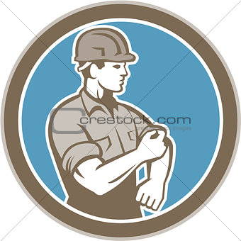 Construction Worker Rolling Up Sleeve Circle Retro
