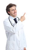 Doctor man presenting an advice pointing at side