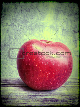 Red apple on grunge background