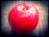 Red apple with water drops