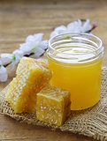 natural organic honey in the comb on a wooden background