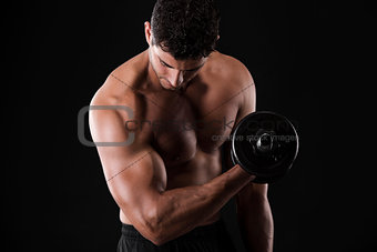 Muscular man lifting weights