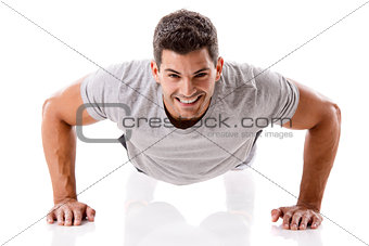 Handsome young man making pushups
