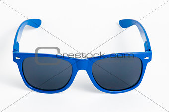 Blue plastic sunglasses isolated on white