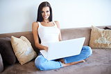 Young woman working from home on a laptop