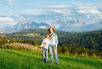 Family on summer mountain hill (Poland)