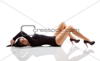 Woman with a stunning body lying on floor