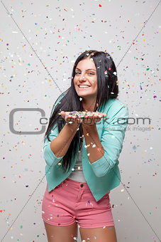 Young beautiful woman in party mood