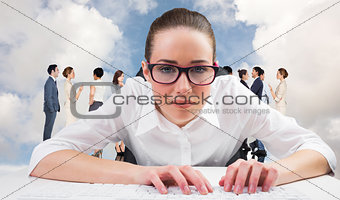 Composite image of businesswoman typing on a keyboard