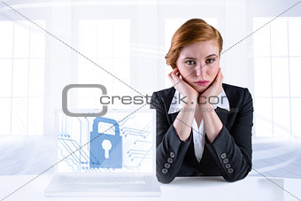 Composite image of redhead businesswoman looking unhappy