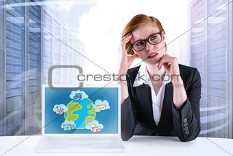 Composite image of thinking redhead businesswoman
