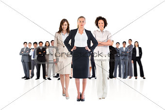 Composite image of team of businesswomen looking at camera