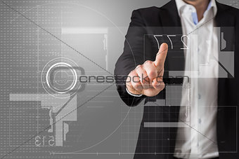 Composite image of businessman standing and pointing at interface