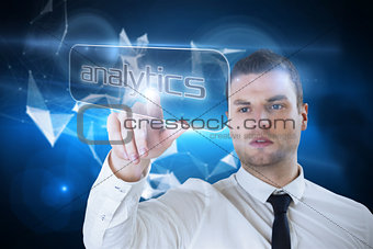 Businessman pointing to word analytics