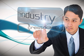 Businessman pointing to word industry