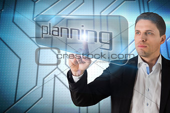 Businessman pointing to word planning