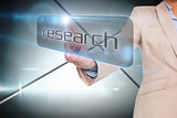 Businesswoman pointing to word research