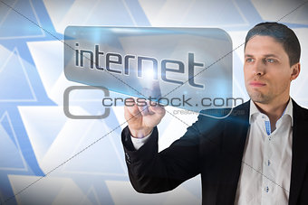 Businessman pointing to word internet