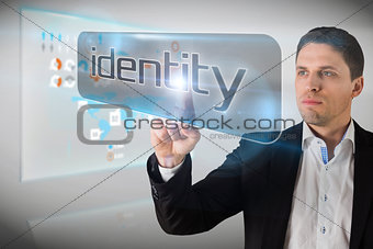 Businessman pointing to word identity