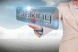 Businesswoman pointing to word stalking