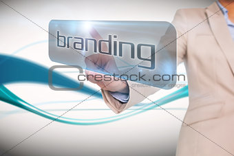 Businesswoman pointing to word branding