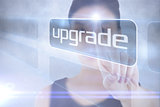 Businesswoman pointing to word upgrade