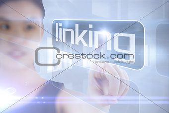 Businesswoman pointing to word linking