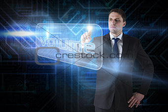 Businessman pointing to word volume