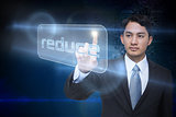 Businessman pointing to word reduce
